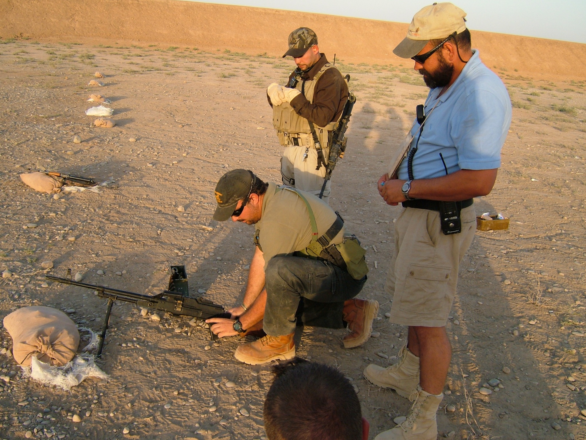 Johan Raath instructing personnel on a firing range in Iraq